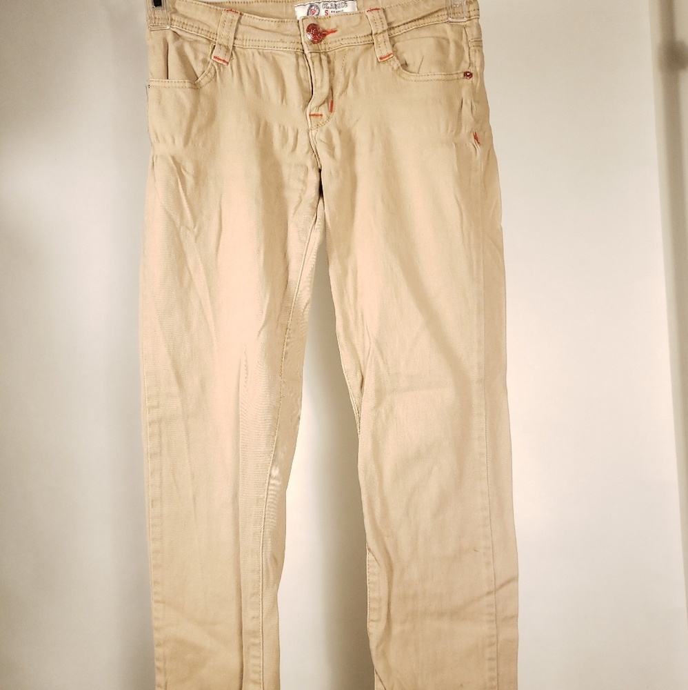 Women. Juniors. Khaki. Jeans with red stitching.